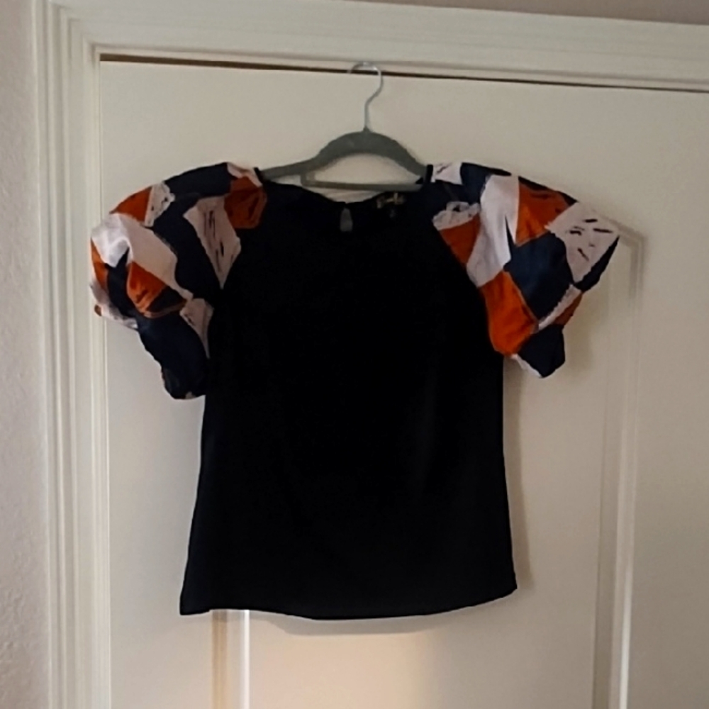 Stylish Black Top with Vibrant Sleeves